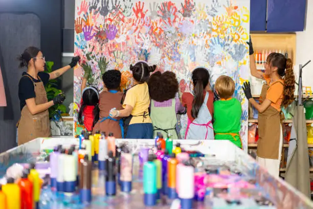 Children engaged in indoor STEM and art projects at camp